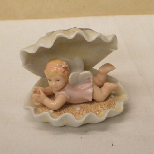 Engeltje in schelp  Navel kopen bij RataPlan webshop!